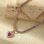“Pink heart pendant on gold tennis chain necklace – romantic tarnish-free jewelry by Yesalna”

